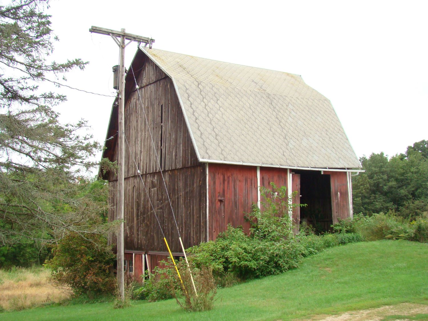 A red barn with white shingles from Perry, MI