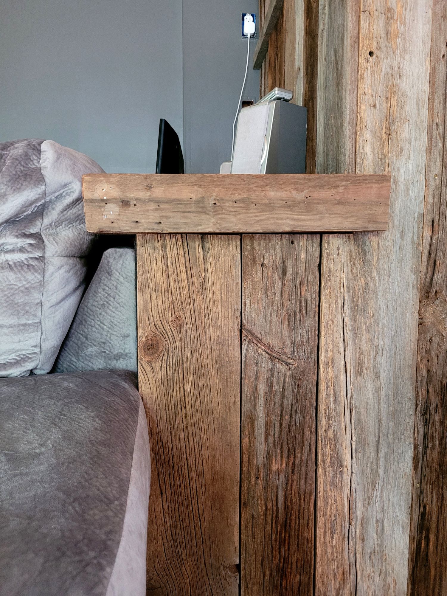 A reclaimed barnwood accent wall installed in a customer's home