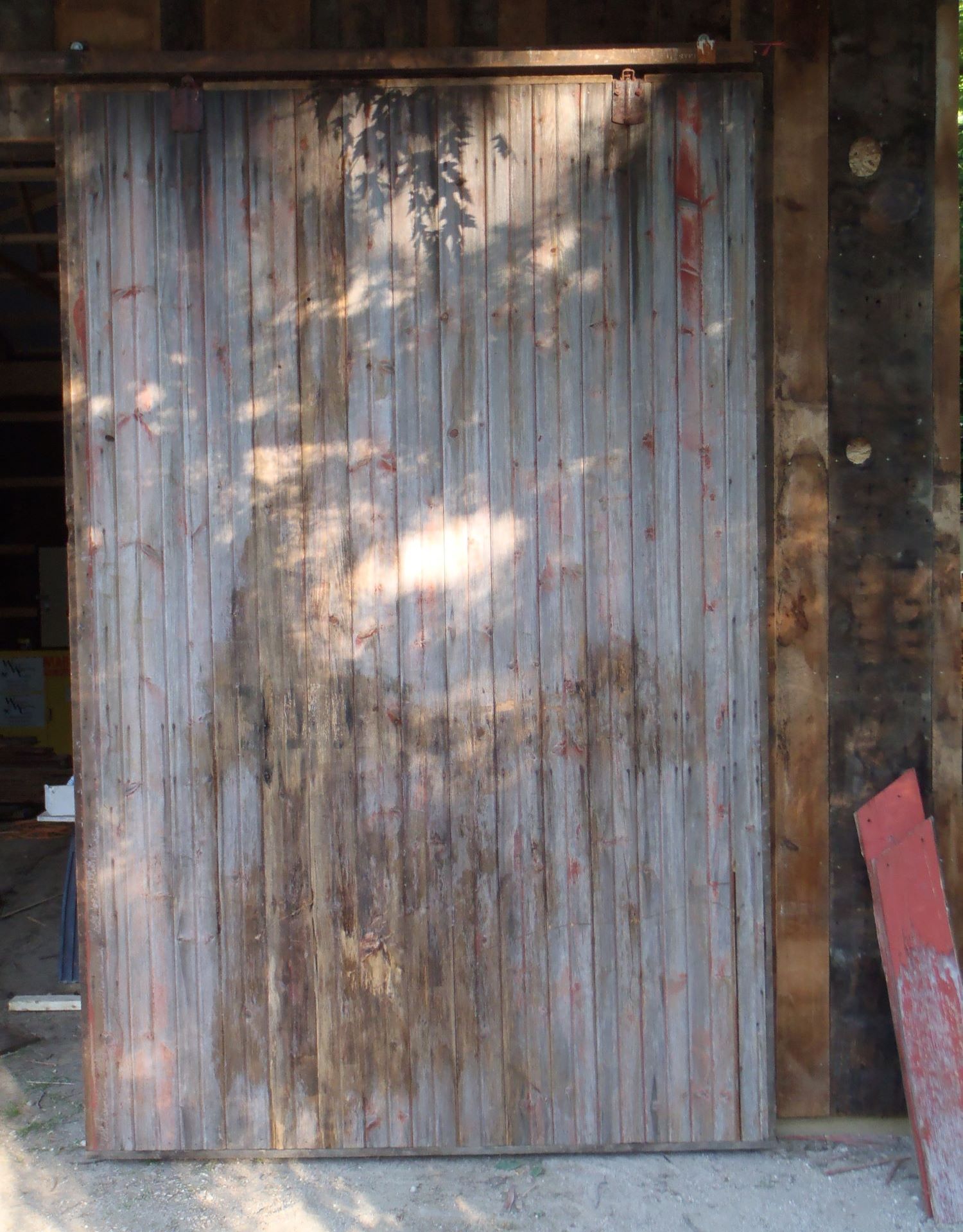 Custom made sliding door propped up in our workshop