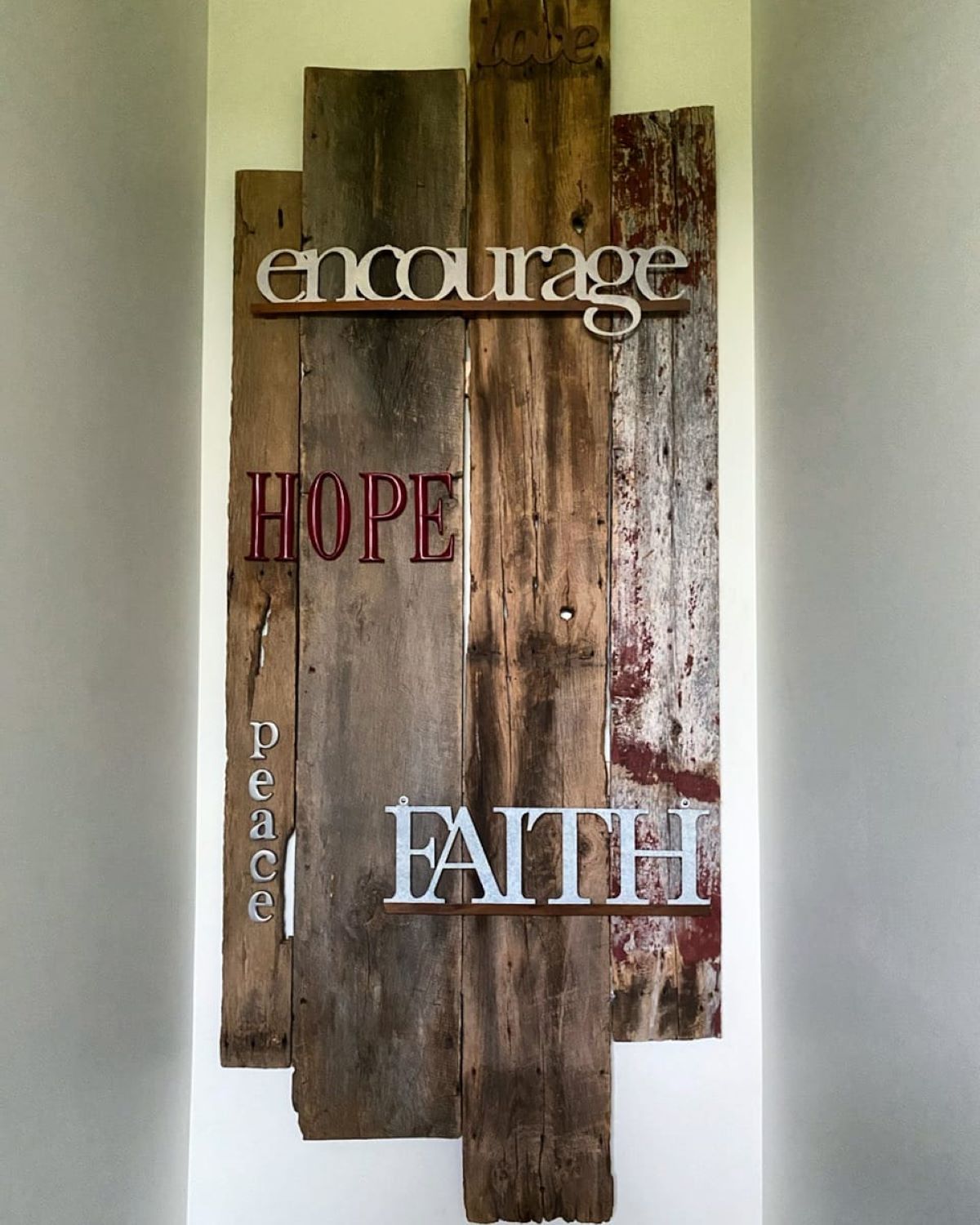 A decorative sign made by a customer using reclaimed barnwood