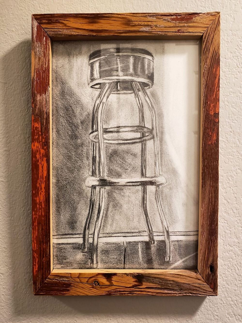 The drawing of a stool in a custom made barnwood frame
