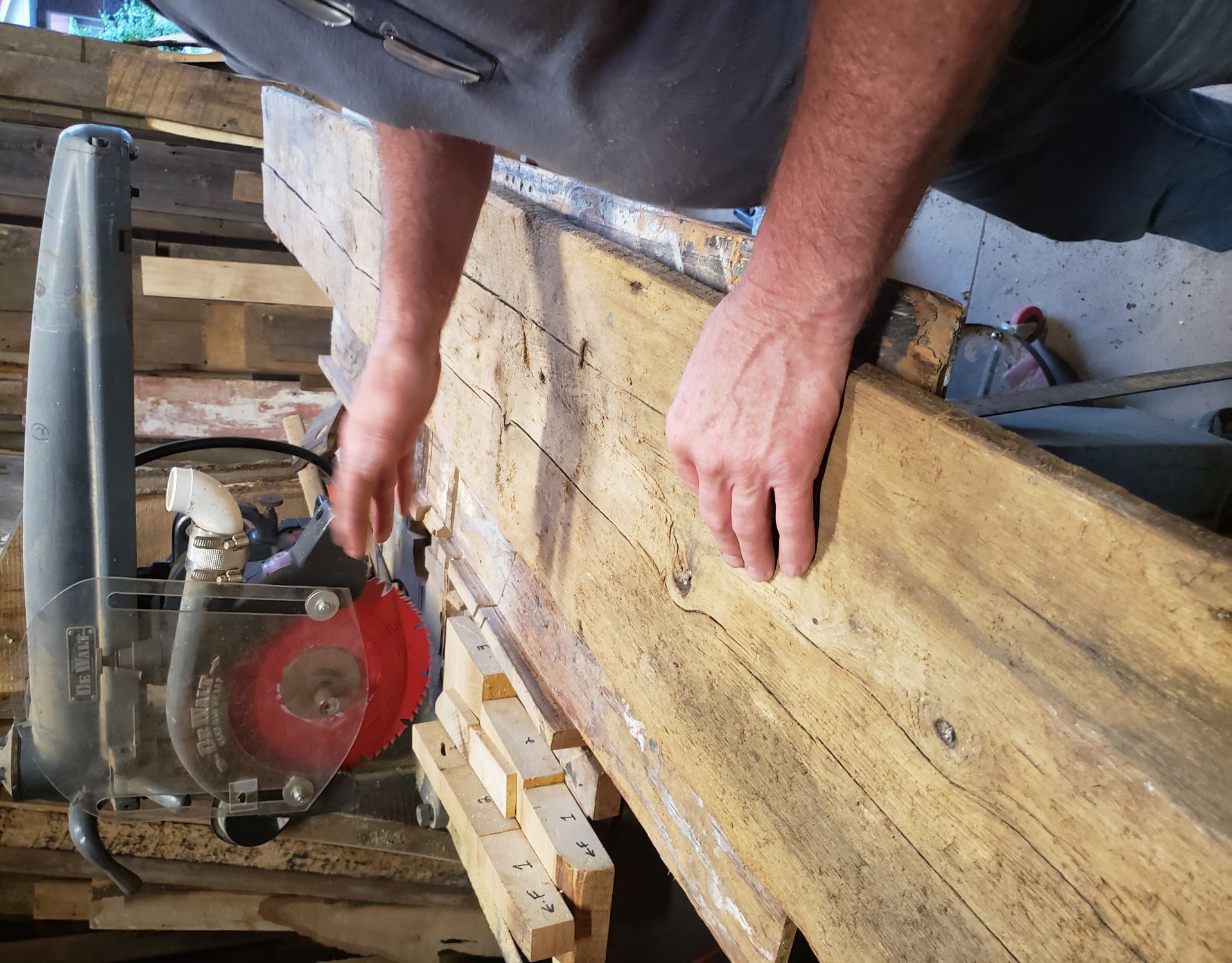 Jim cutting reclaimed wood for a set of shelves