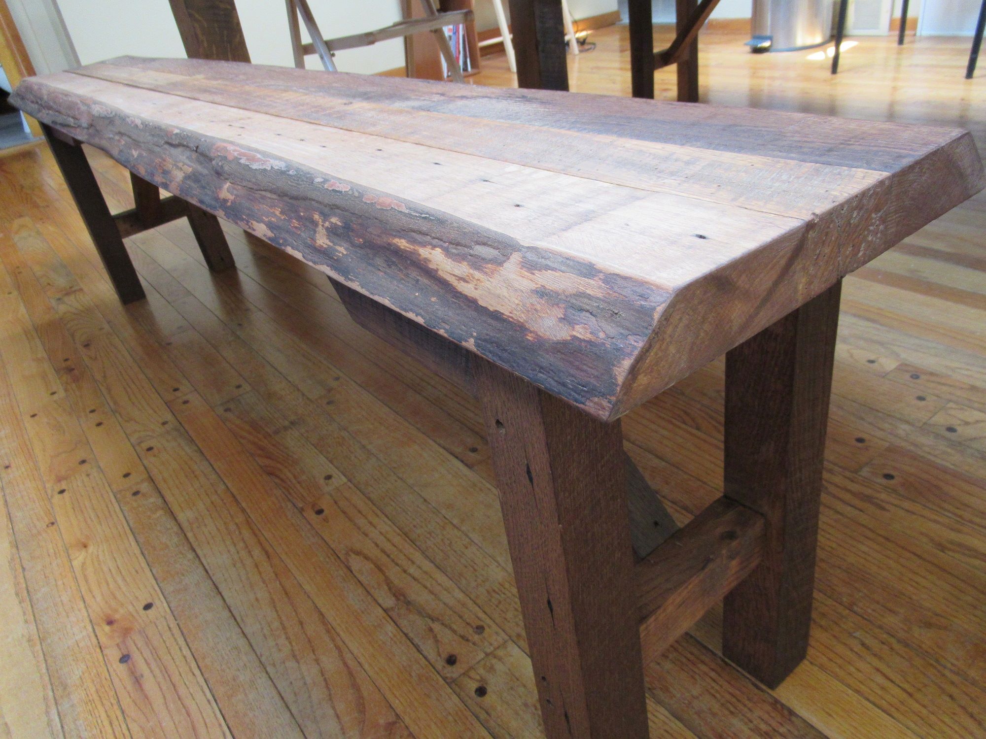 A custom built barnwood bench, made for one of our viking tables