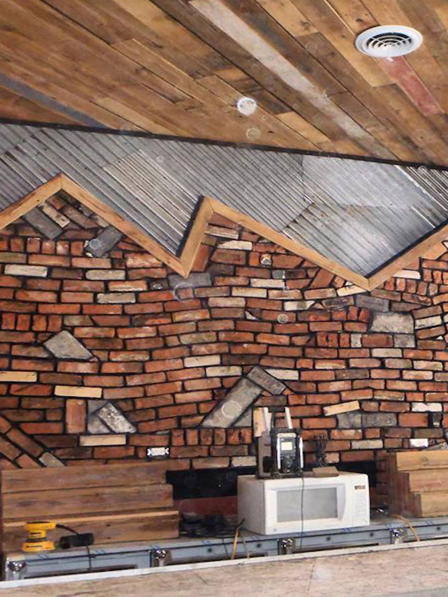 Custom accent wall installed at a local barbeque restaurant