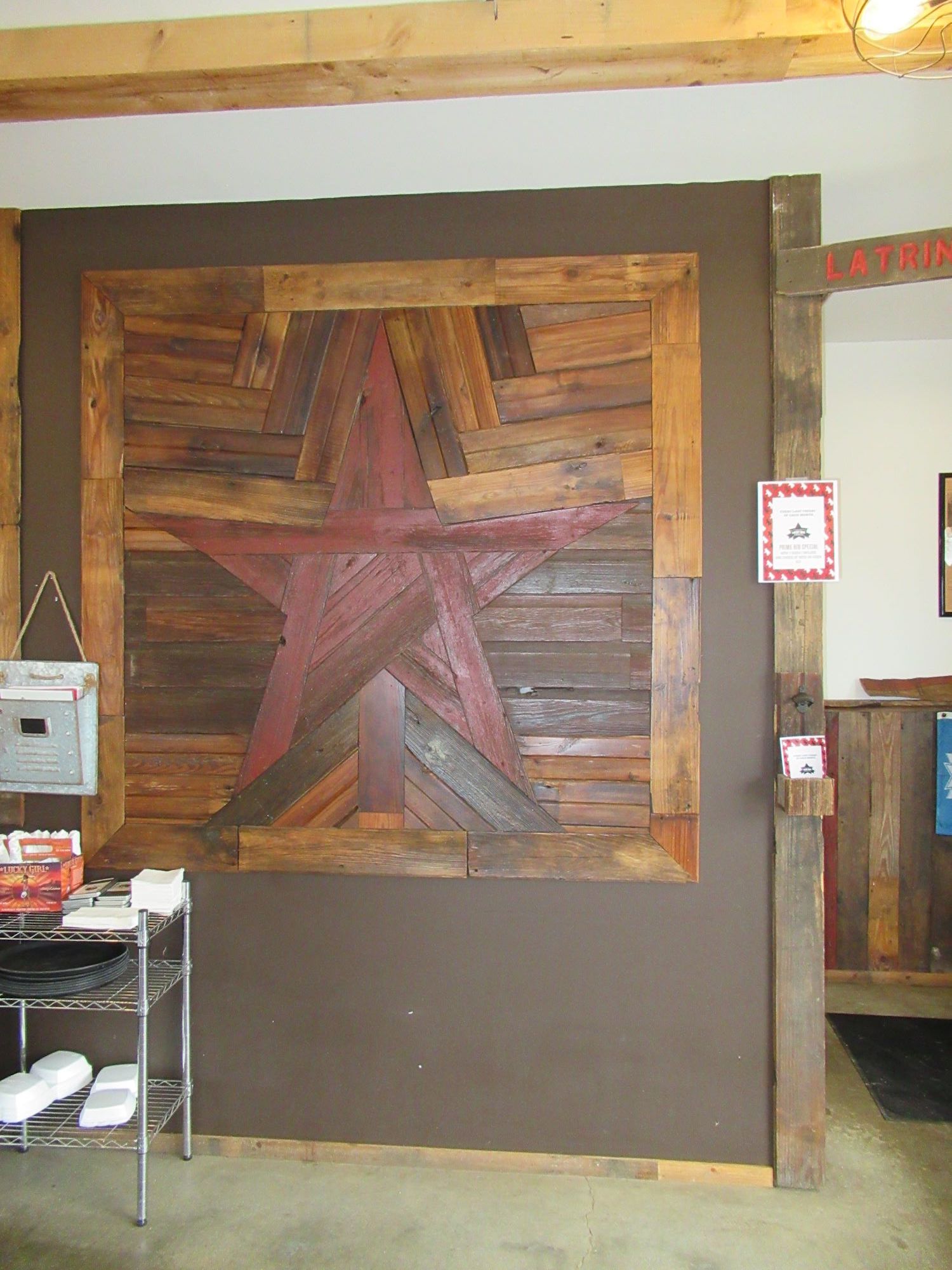 An accent piece made from reclaimed barnwood installed on the wall at Lucky Girl Brewery