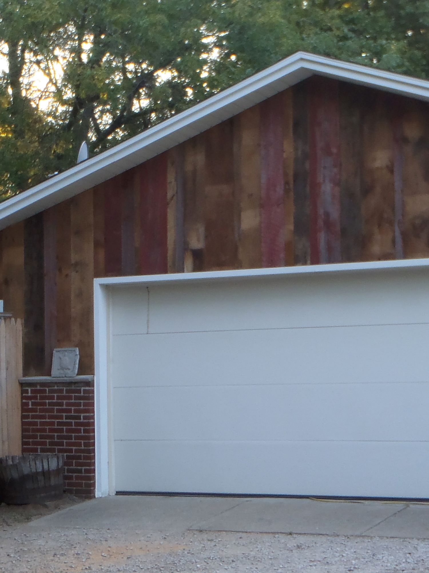 Reclaimed wood siding on the garage of a house