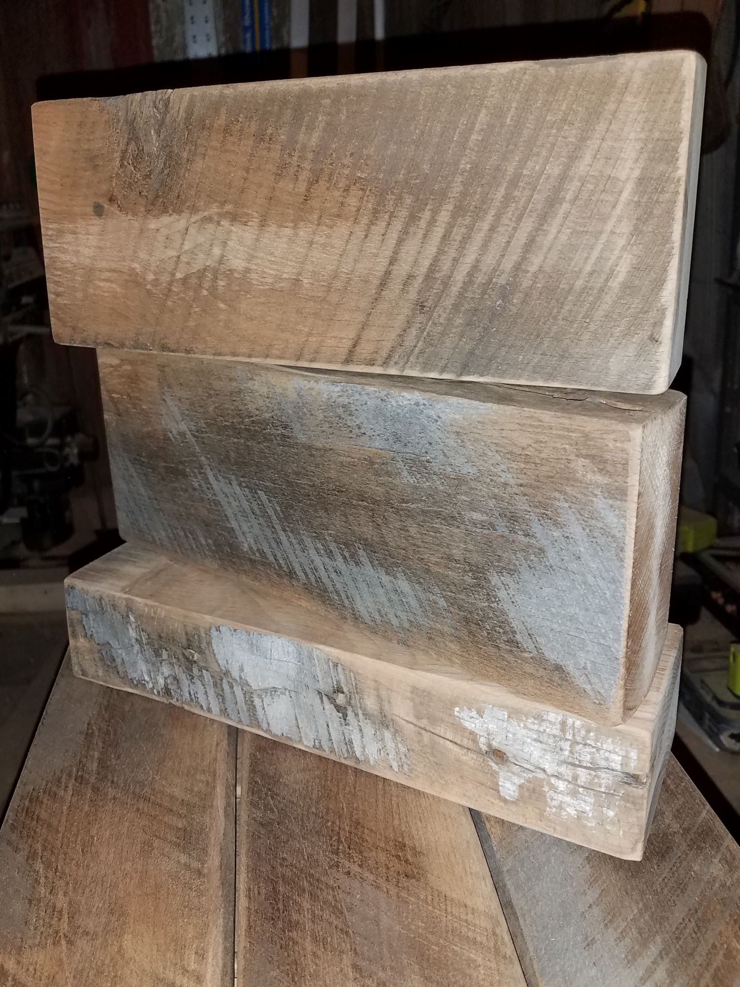 A few pieces of reclaimed barnwood that will be made into a giant jenga set
