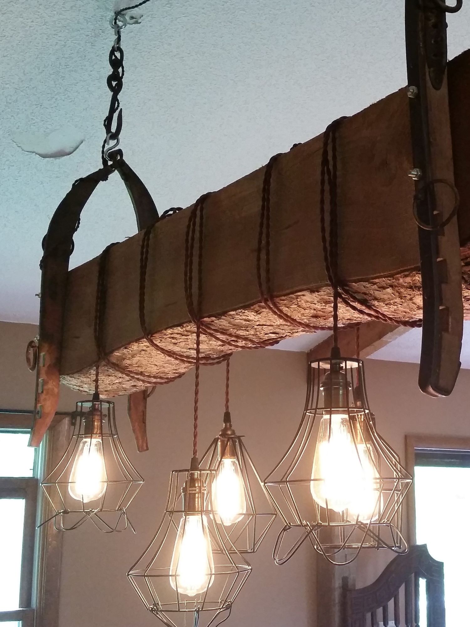 Photograph of a custom light made by one of our customers using a reclaimed barn beam