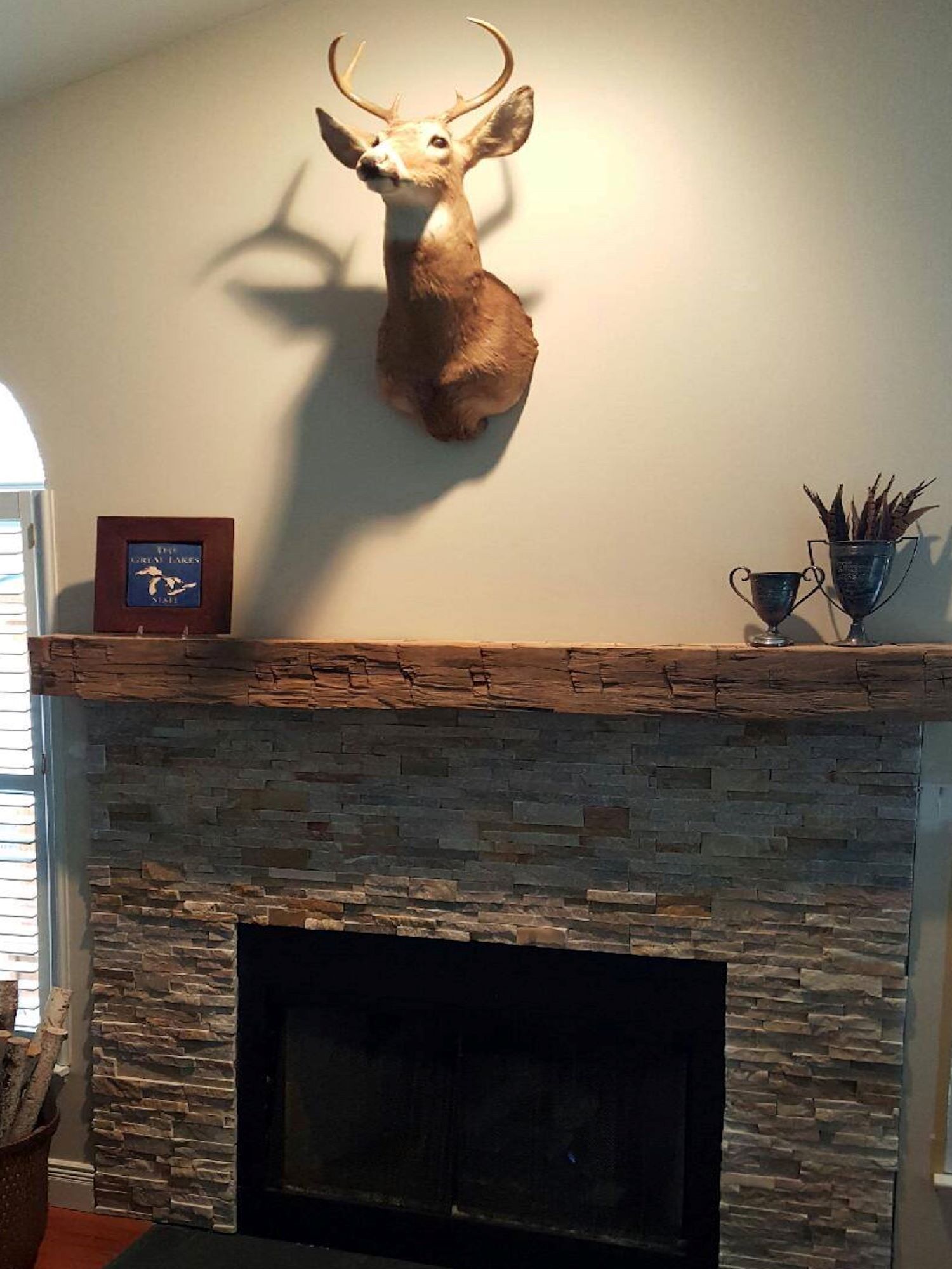 Reclaimed beam mantle in a customer's living room