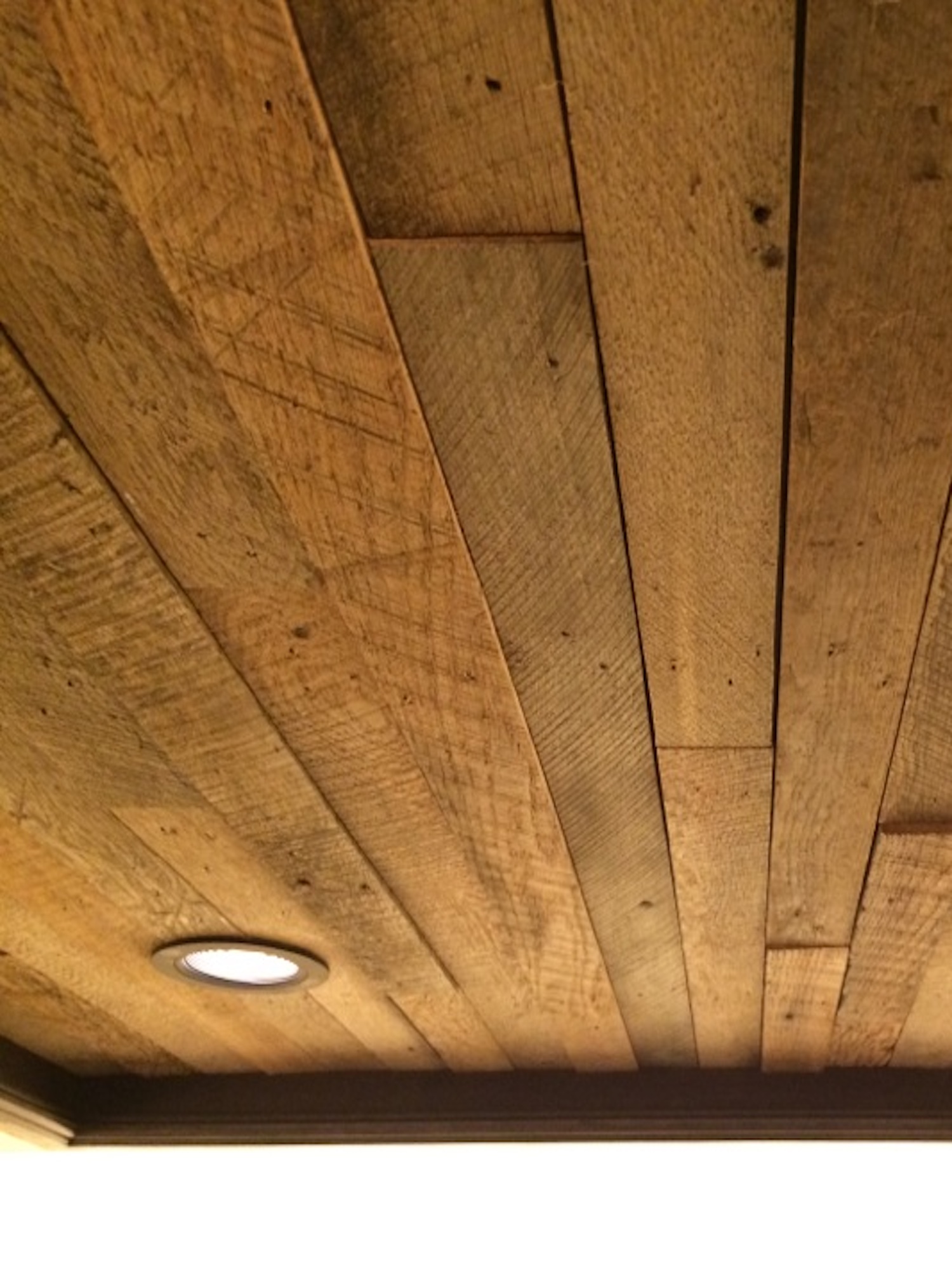 Reclaimed barnwood ceiling in a customer's home