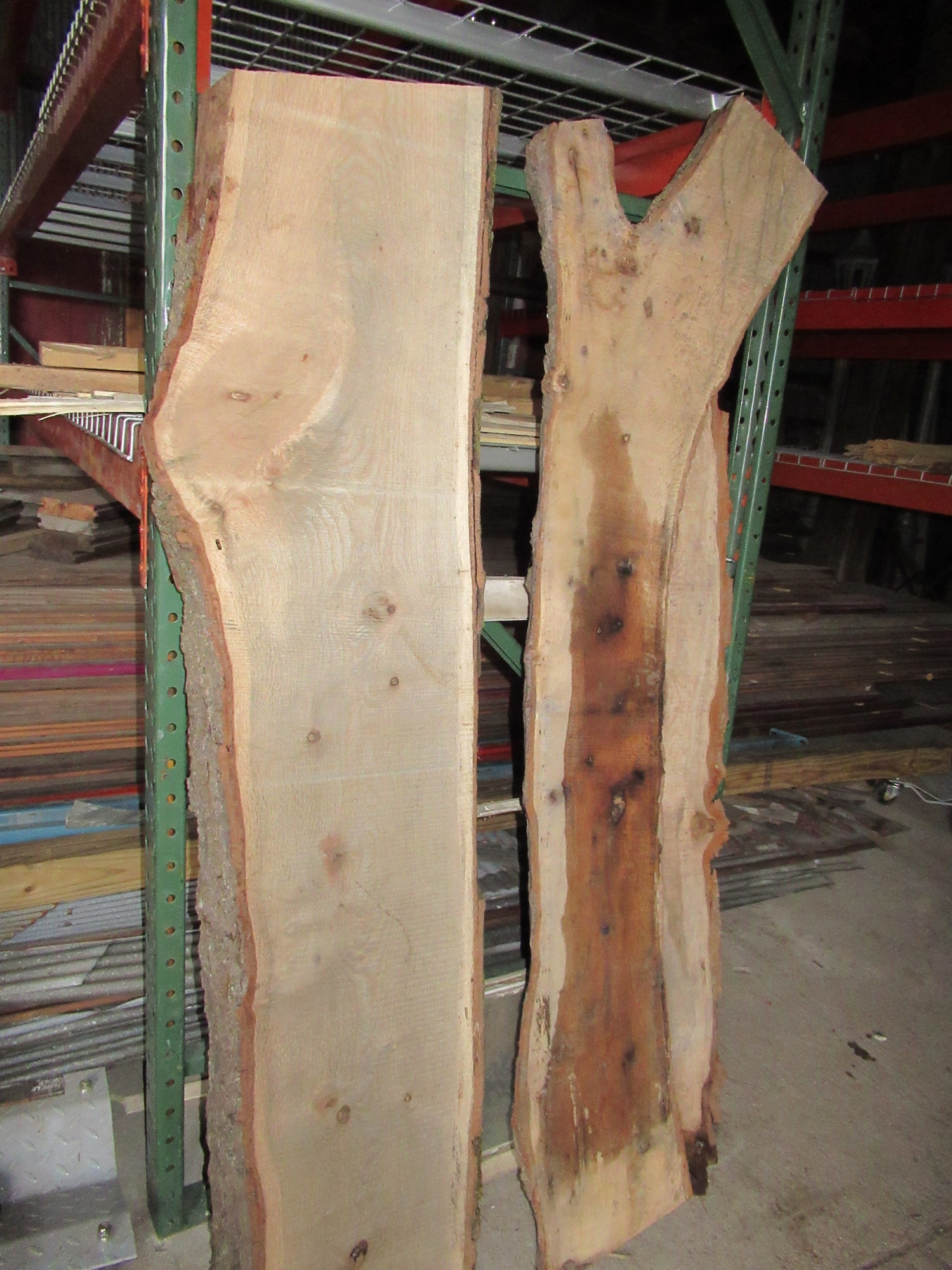 Live edge slabs propped up in the warehouse