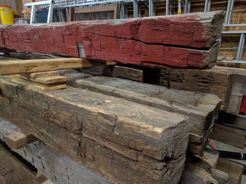 White oak and poplar barn beams stacked at our Southeast Michigan warehouse