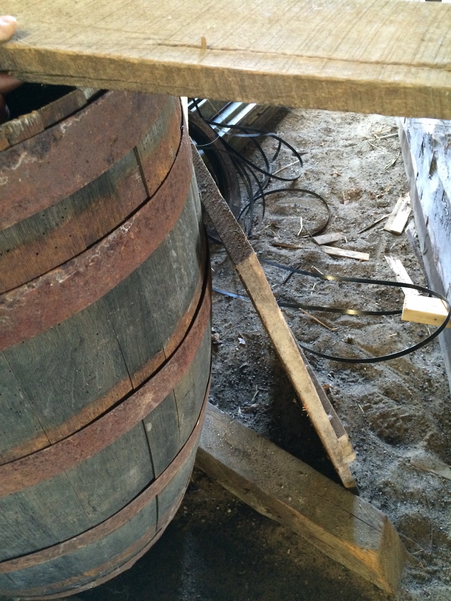A wooden barrel found inside of a barn