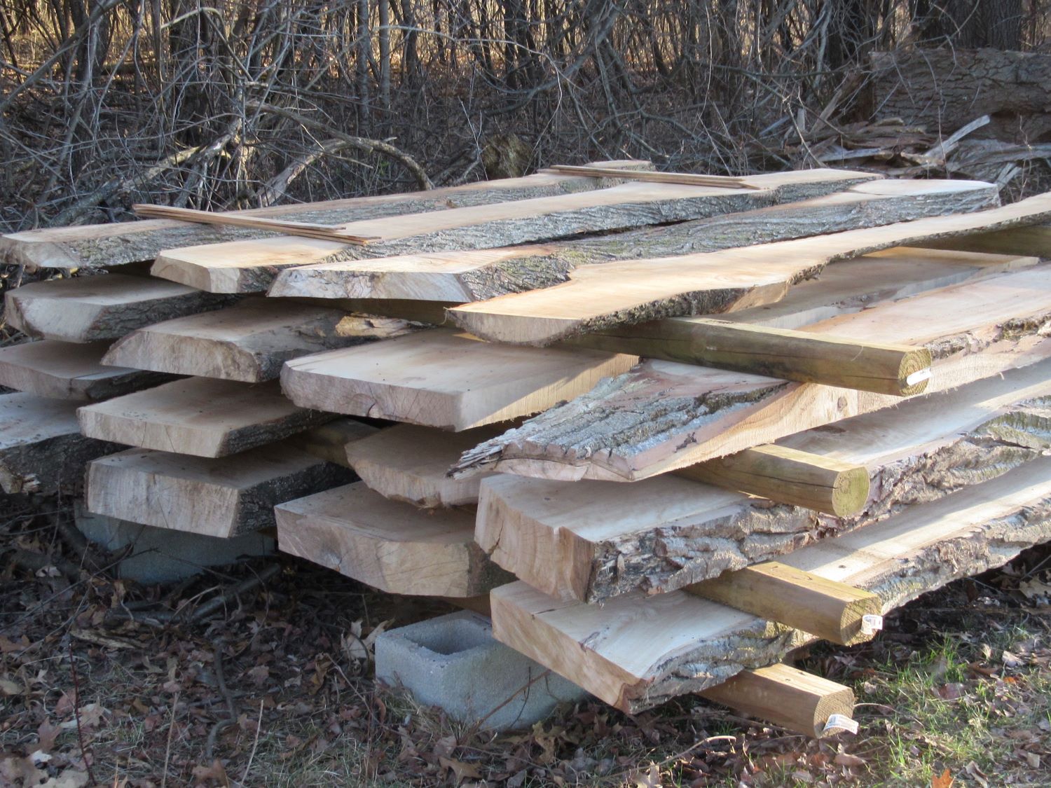 Live edge slabs stacked at our milling site